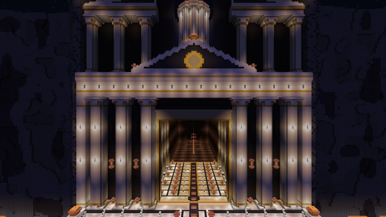 A white columned temple front lit from inside against dark rock