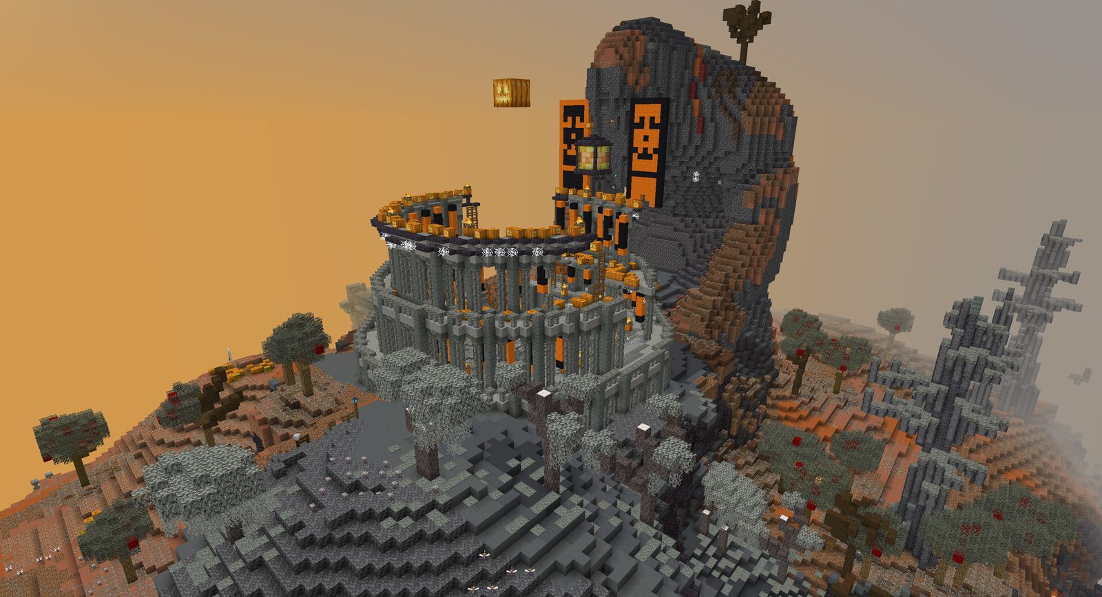 A ruined colosseum on a hillside beside a giant stone titan