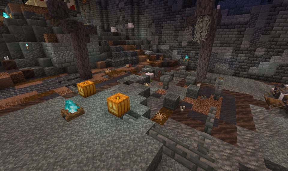 A graveyard at night with carved pumpkins and soul lanterns