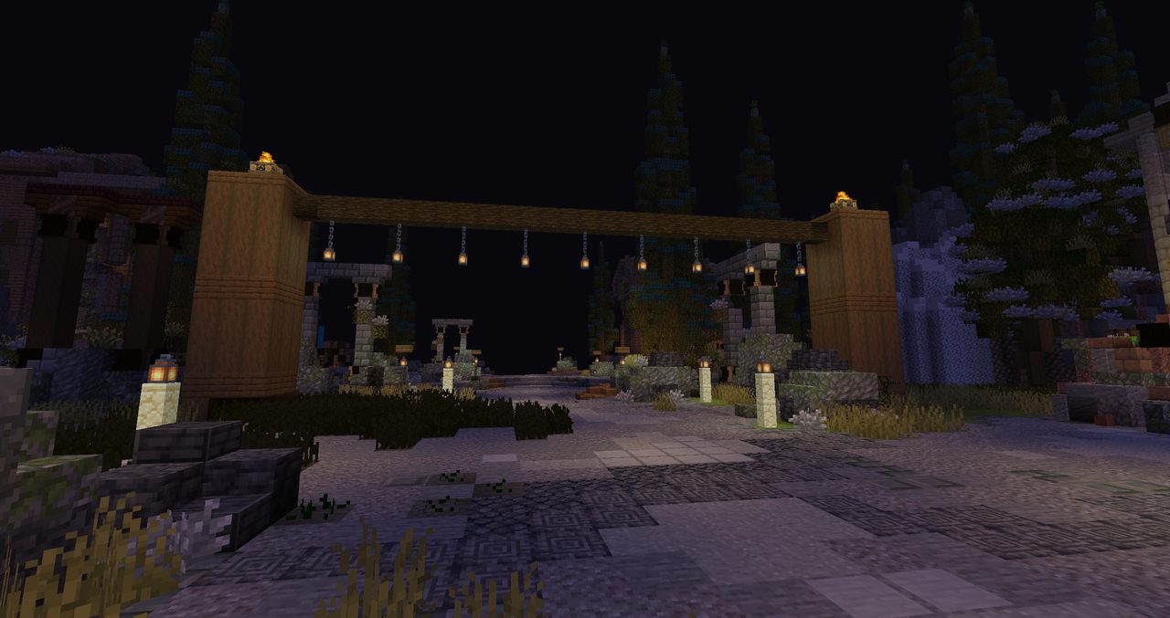A timber gate hung with lanterns over a stone road at night