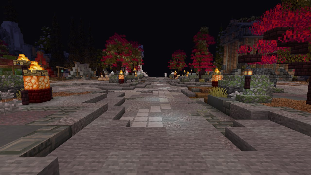 A wide stone road at night lined with glowing braziers and red autumn trees