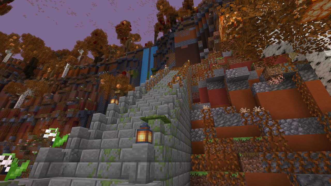A stone stair climbing past a waterfall and autumn trees